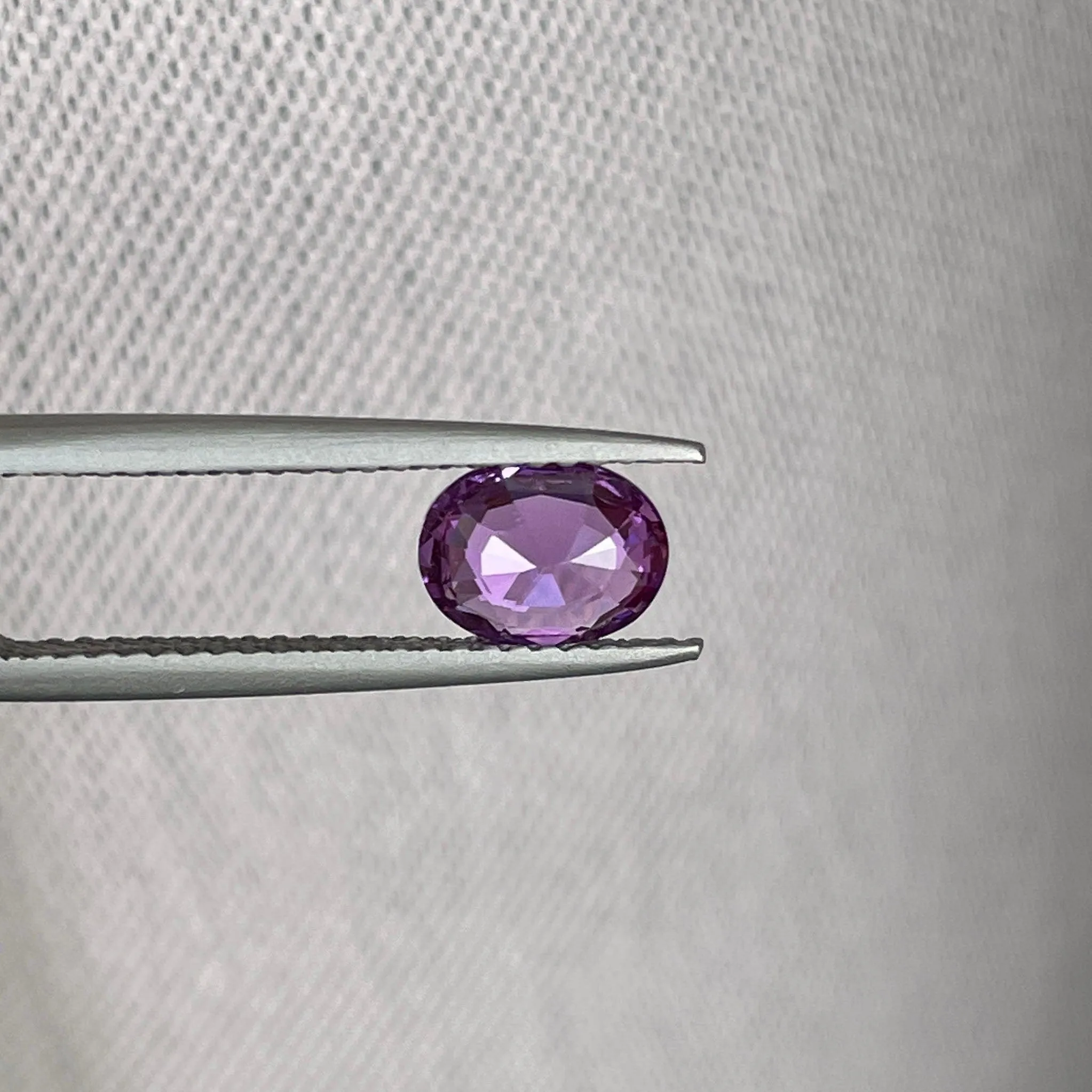 loose purple sapphire 1.10 crt purple pink sapphire online,  selling loose gemstones online for october birthstone jewelry as fiance ring, made to order engagement rings in new world gems selling loose gemstones online